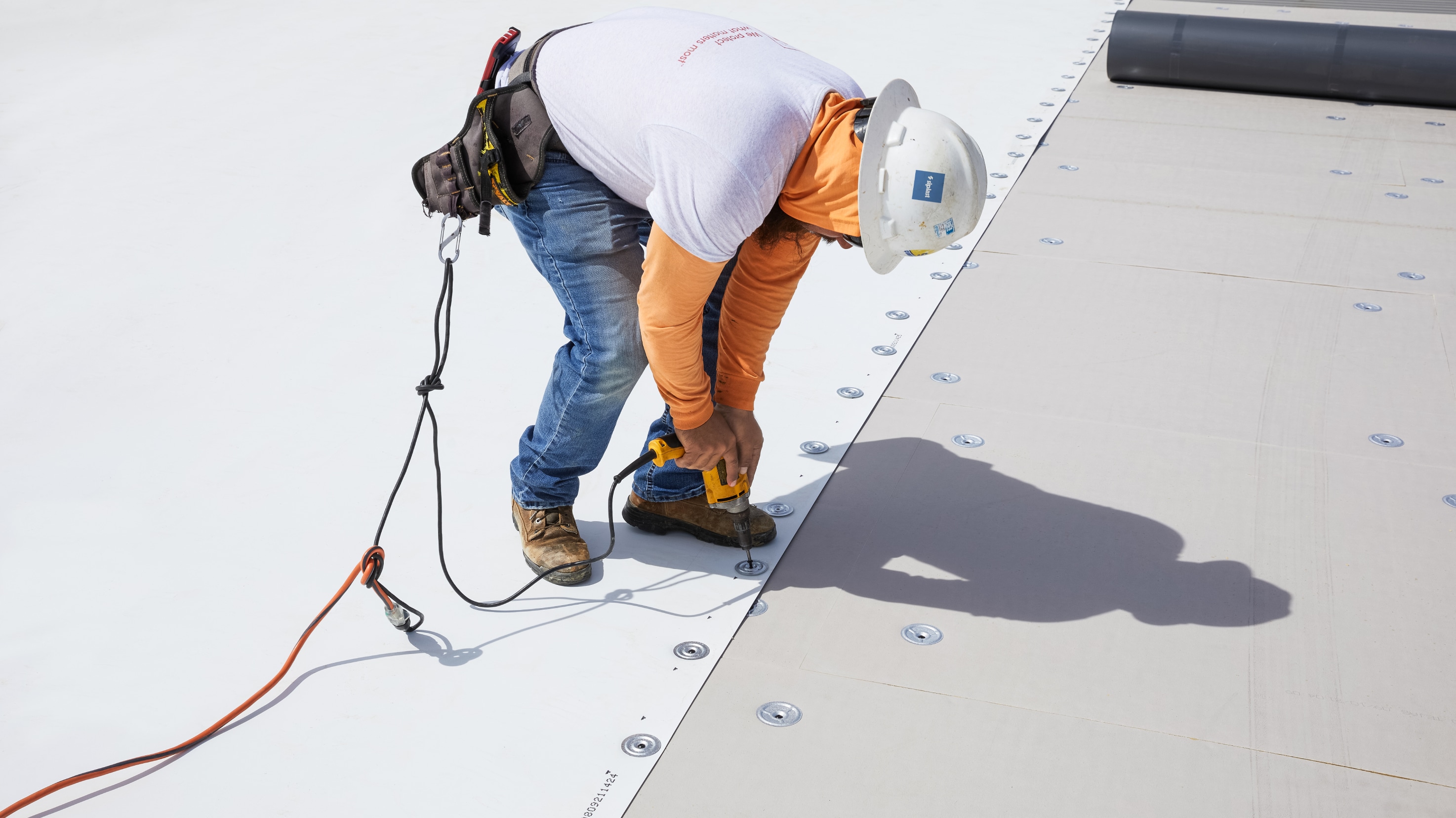 Roof underlayment system installation with membrane fastening