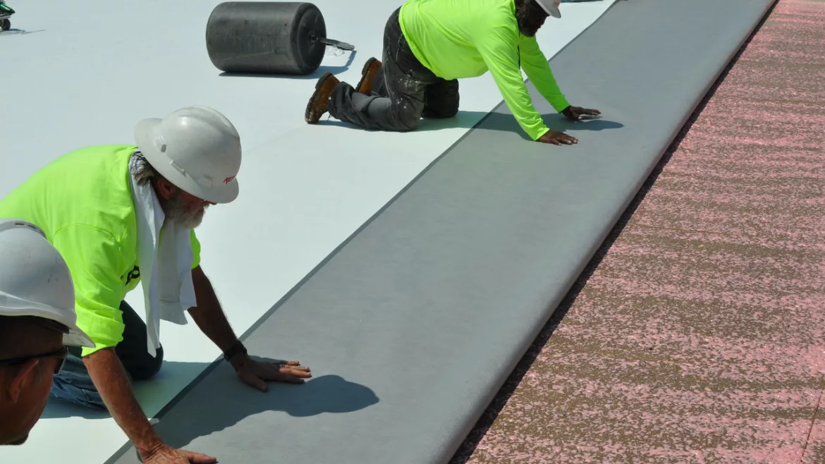Roof waterproofing membrane installation on a flat roof